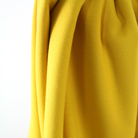 Fairtrade Biojersey uni Senf (GOTS)