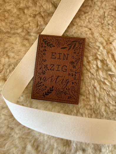 Kunstlederlabel "Einzigartig"